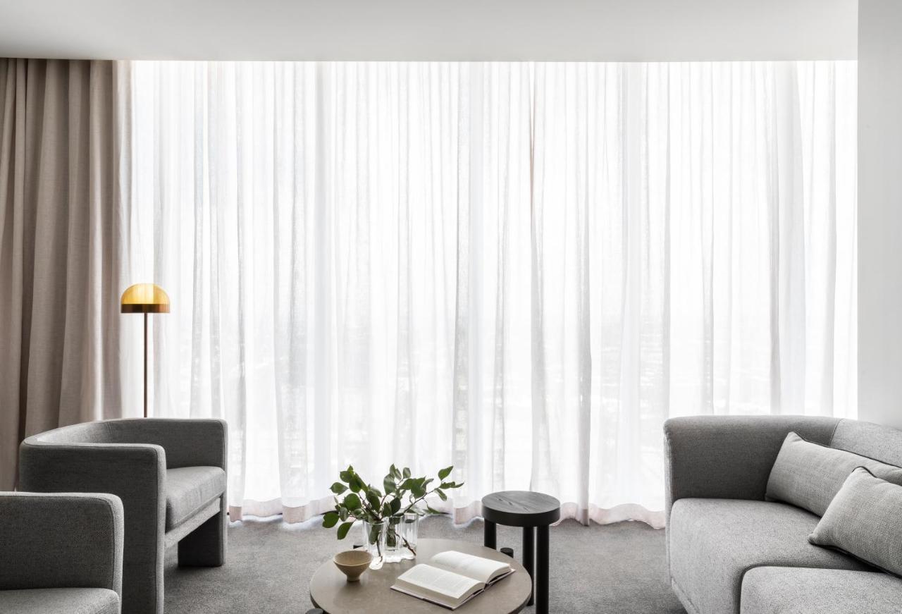 Oakwood Premier Melbourne Aparthotel Εξωτερικό φωτογραφία A living room with sheer curtains
