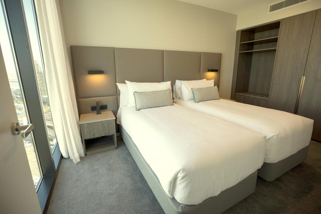 Oakwood Premier Melbourne Aparthotel Εξωτερικό φωτογραφία A bedroom at the hotel